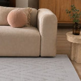 Light Grey Wool and Viscose Rug – Ikat, in a living room