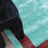 Blue and Burgundy Viscose Rug – Annamitique, in a living room