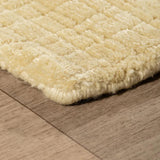 Vloerkleed geel van gerecycled PET – Mako – detail van de rand
