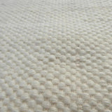 Tapis blanc en laine – Milhac : détail du tissage