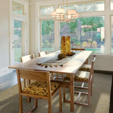 Vloerkleed geel en wit van wol – Milhac, in een eetkamer