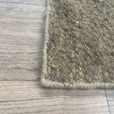 Vloerkleed bruin van wol – Coolest – detail van de rand