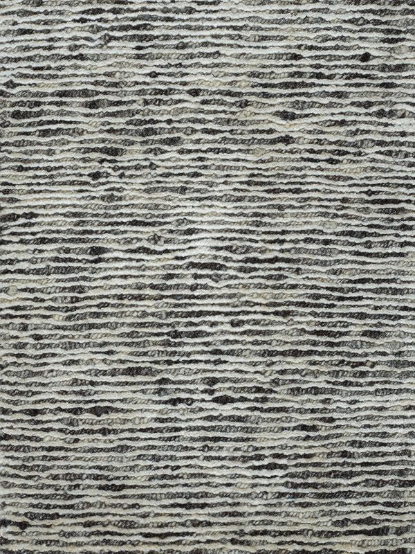 Gros plan sur le tapis blanc gris – détail du tissage en laine et soie de bambou, aspect brillant et luxueux