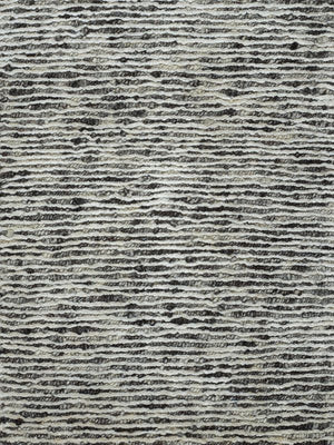 Gros plan sur le tapis blanc gris – détail du tissage en laine et soie de bambou, aspect brillant et luxueux