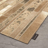 Alfombra marrón y beige de cuero – Starmo – detalle del borde