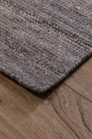 tapis marron beige en PET recyclé, style vintage, vue de coin, texture résistante pour intérieur ou extérieur