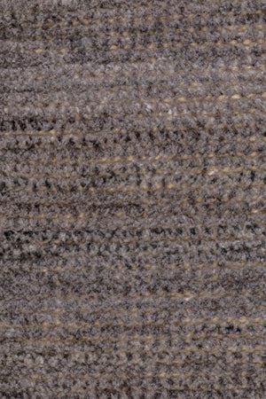 détail texture tapis vintage responsable en PET recyclé marron beige, fibres résistantes intérieur extérieur