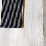 White and Black Wool and Viscose Rug – Birkin – close-up of the edge