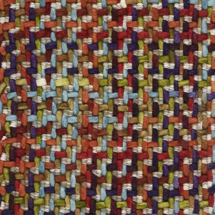 Gros plan sur la texture du tapis coloré en laine avec effet tweed-tartan, montrant les détails du tissage
