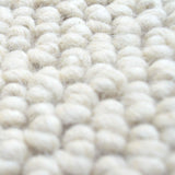 Wit wollen lussenkleed – Lagune – detail van de weving