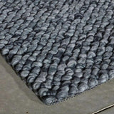 Tapis gris bleu à poils longs en laine – Waves : détail de la bordure