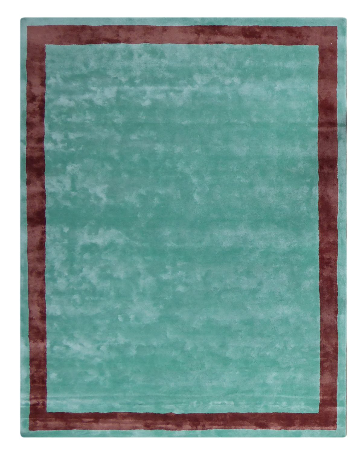 Tapis en viscose bleu et marron, vue de face, mettant en valeur ses motifs et ses couleurs raffinées