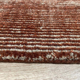 Alfombra terracota beige de lana y poliamida – Magnifique – detalle del borde