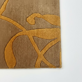 Tapis marron et orange tissé main – Emporium : détail de la bordure
