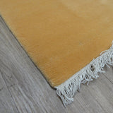Teppich Rot und Gold aus Wolle – Kathmandu – Detail der Kante