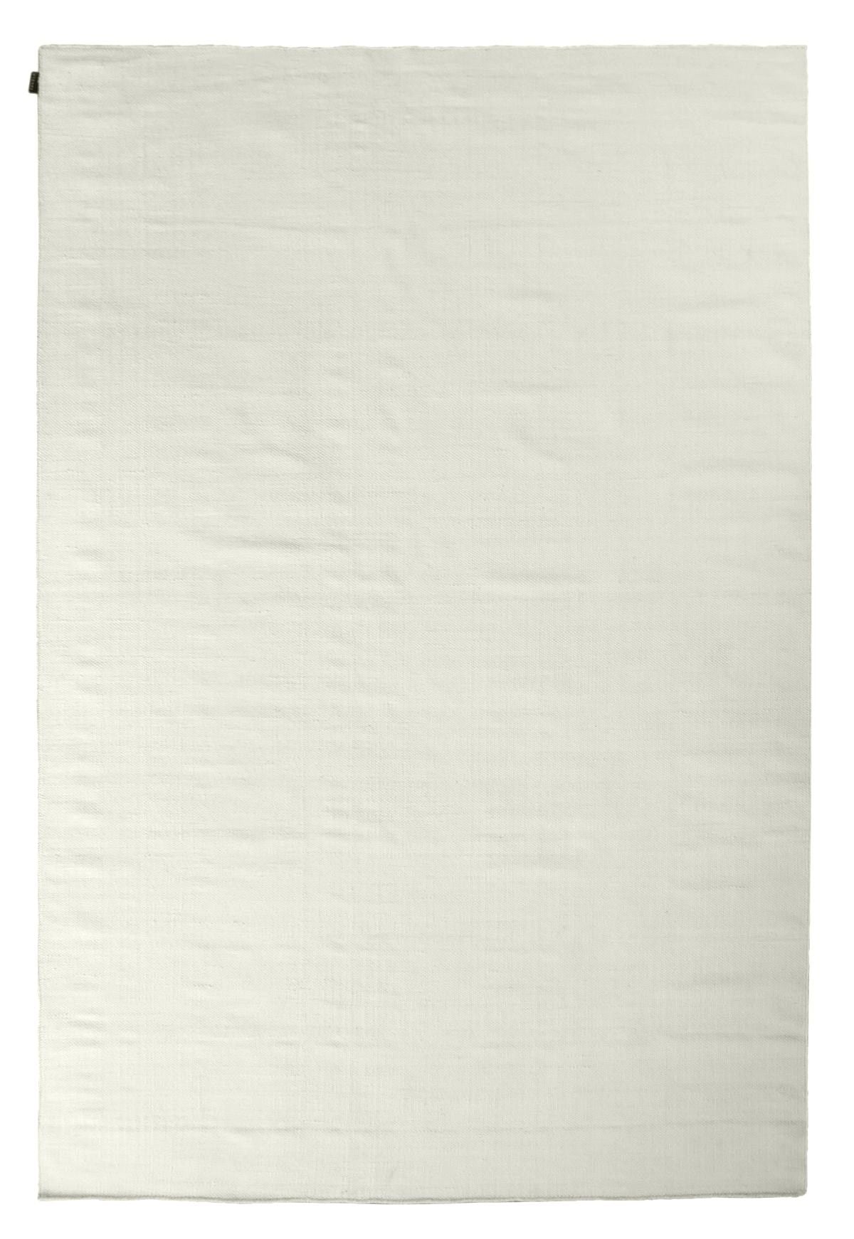 Tapis tissé plat en laine blanche, modèle uni, présenté en vue de face