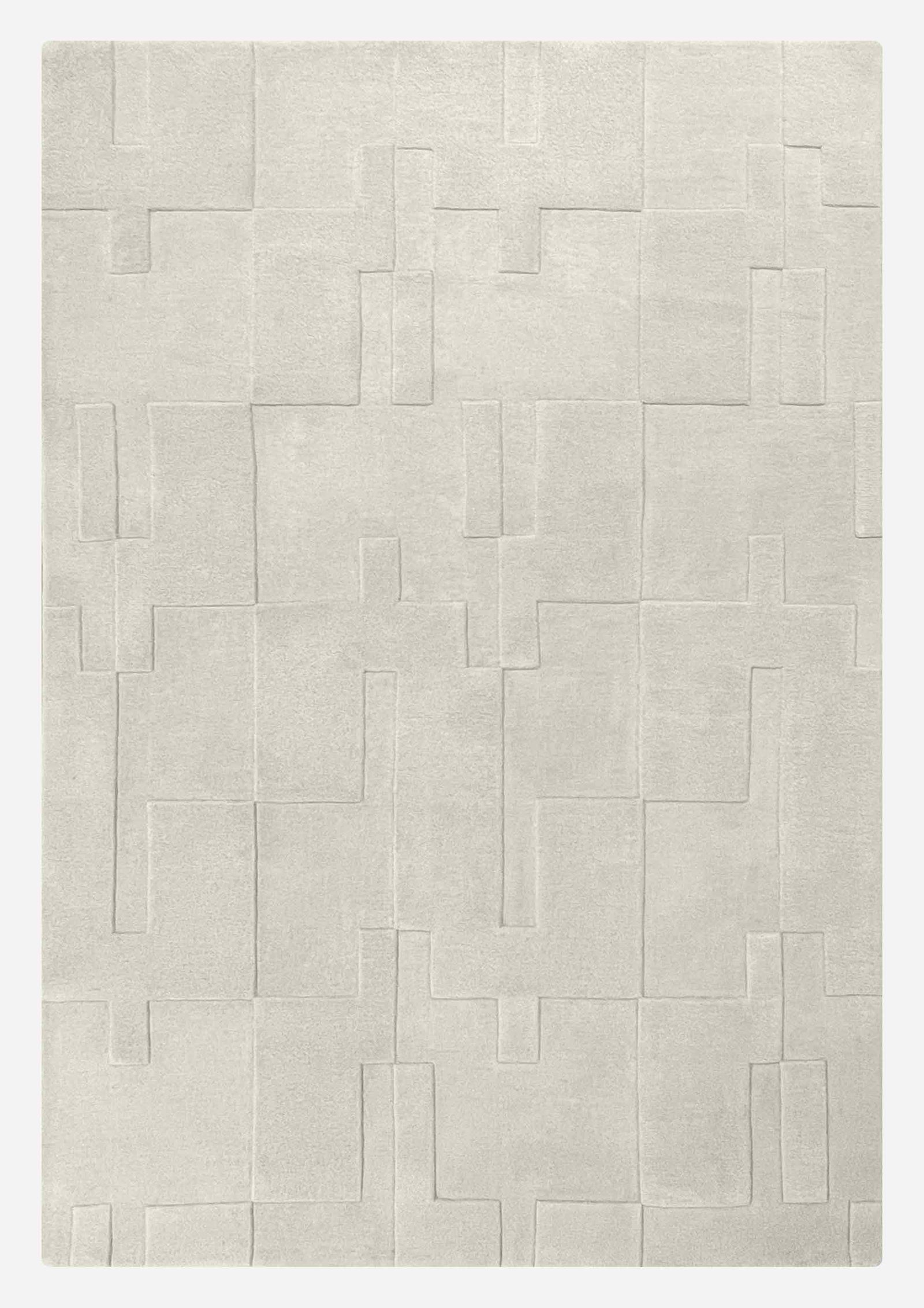 Grand tapis en laine de Nouvelle-Zélande blanc cassé, motifs géométriques en relief – vue de face complète