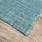 Tapis rond bleu turquoise en PET recyclé 250R – Mako : détail de la bordure