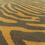 Teppich Zebra Schwarz und Orange aus Wolle – Eden – Detail der Webstruktur